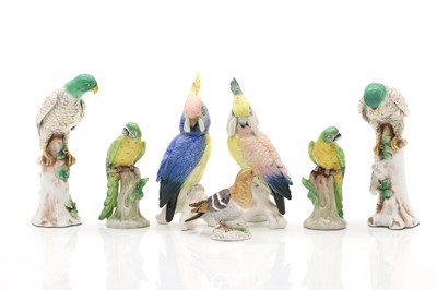 Lot 114 - A collection of ceramic parrots and birds