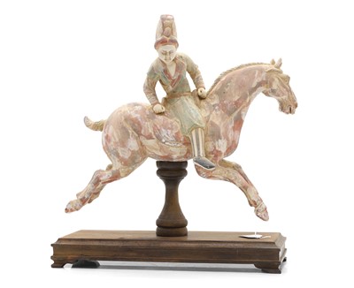 Lot 174 - A Chinese painted pottery figure of a horse and rider