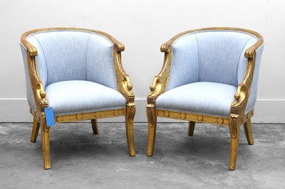 Lot 519 - A pair of upholstered tub chairs