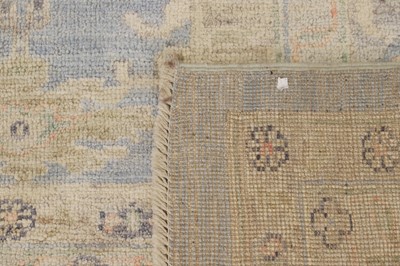 Lot 36 - An Oushak wool carpet
