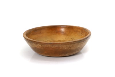 Lot 107 - A turned fruitwood milk bowl