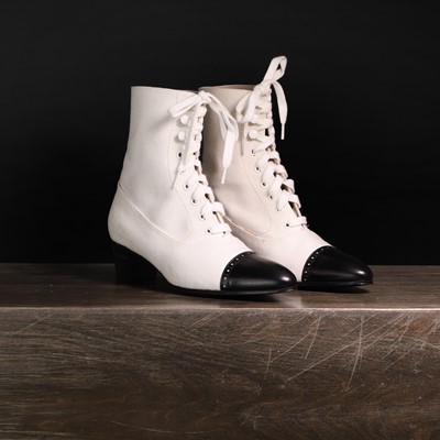 Lot 1388 - A pair of Chanel black and white boots