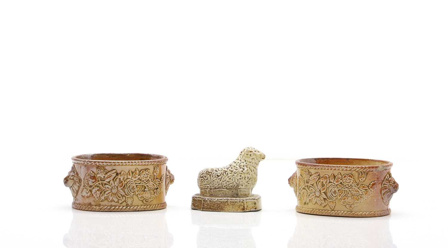 Lot 62 - A pair of salt-glazed stoneware butter dishes