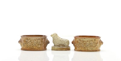 Lot 62 - A pair of salt-glazed stoneware butter dishes