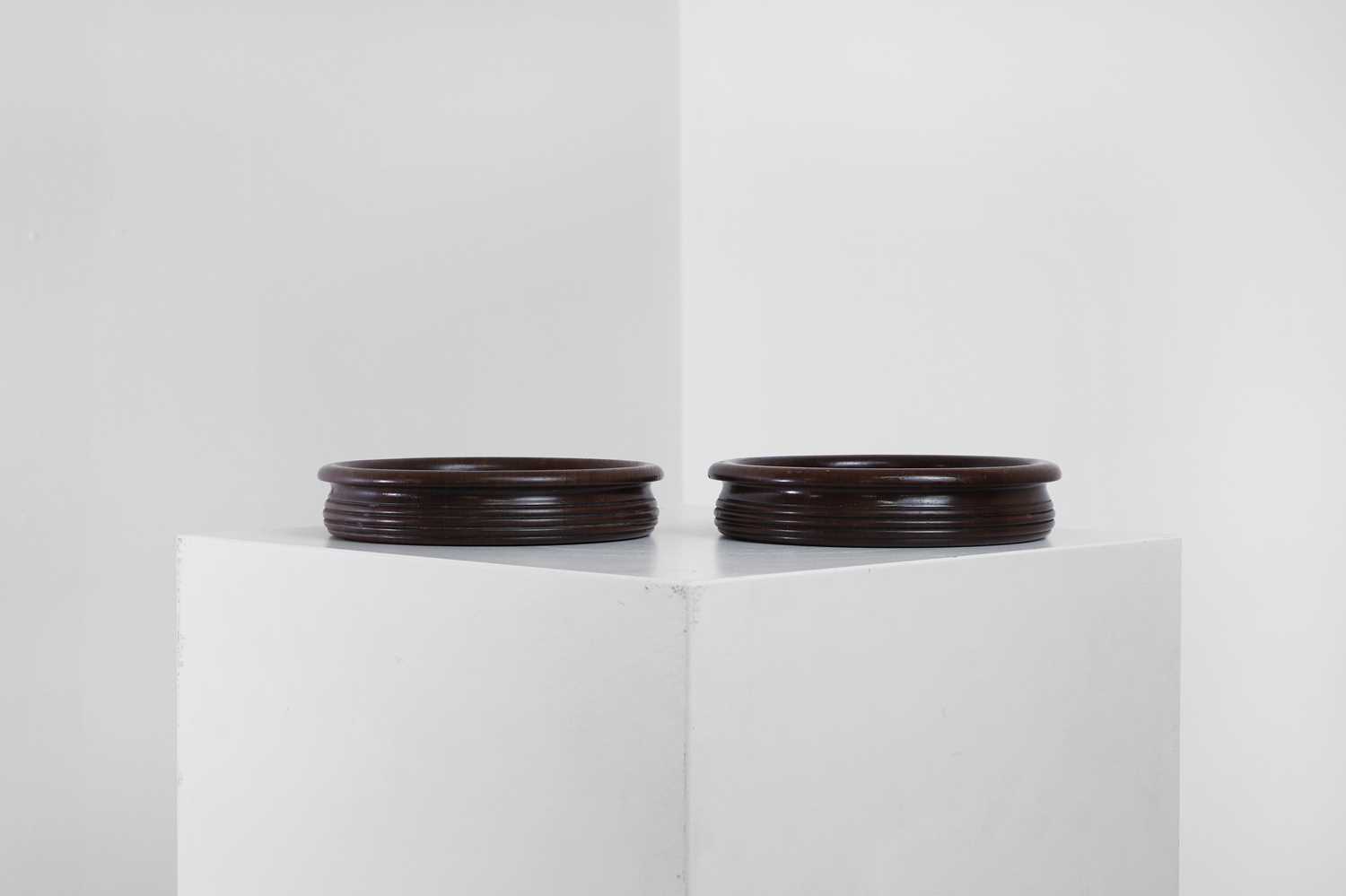Lot 405 - A pair of Regency-style mahogany bottle coasters