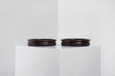 Lot 405 - A pair of Regency-style mahogany bottle coasters
