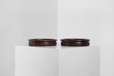 Lot 405 - A pair of Regency-style mahogany bottle coasters