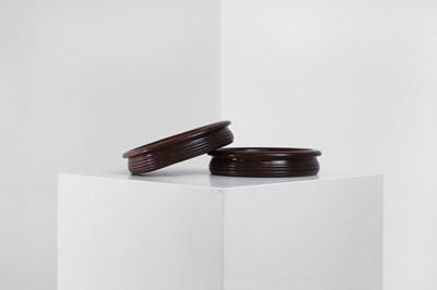 Lot 405 - A pair of Regency-style mahogany bottle coasters