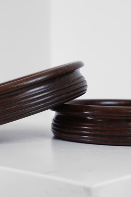 Lot 405 - A pair of Regency-style mahogany bottle coasters