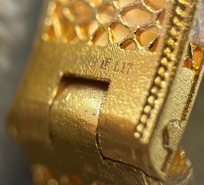 Lot 170 - A Chinese gold enamel and mother-of-pearl bangle, by Liufu