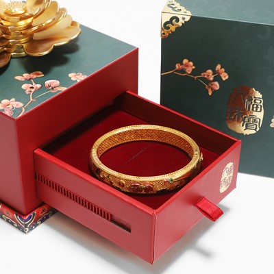 Lot 170 - A Chinese gold enamel and mother-of-pearl bangle, by Liufu