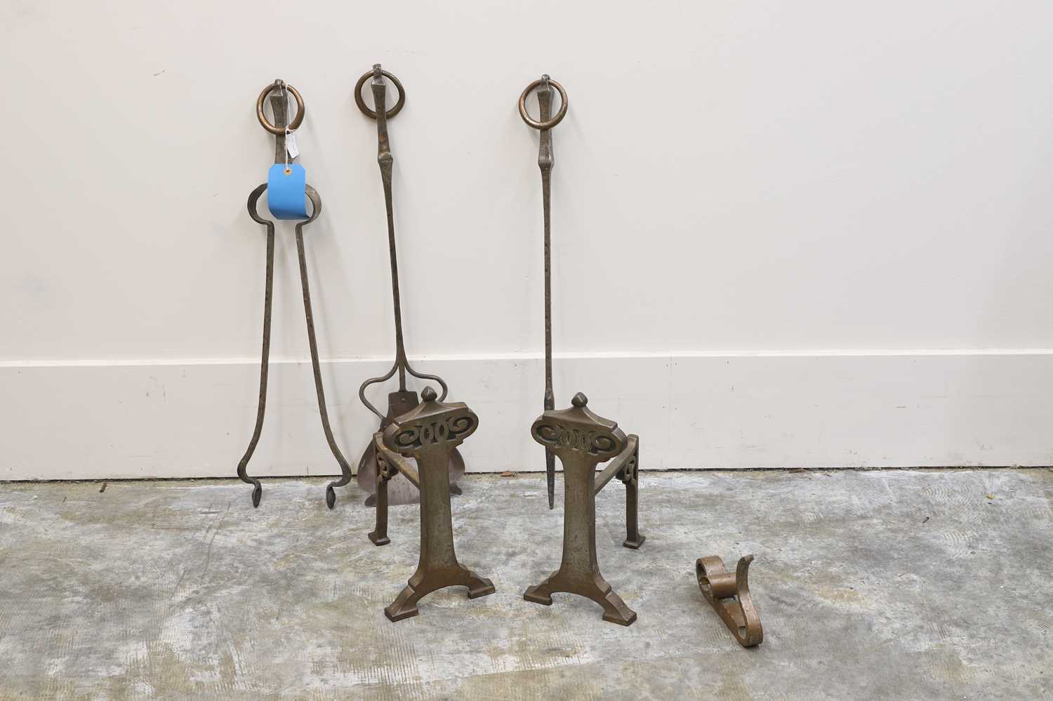 Lot 521 - A collection of Art and Crafts steel fire irons