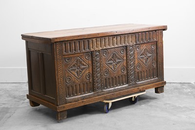 Lot 512 - A carved oak coffer