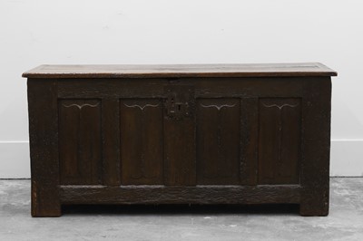 Lot 520 - An oak four panelled linen fold carved coffer