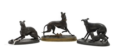 Lot 252 - A group of three bronze dog figures