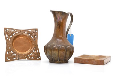 Lot 308 - An Arts and Crafts copper jug and two dishes