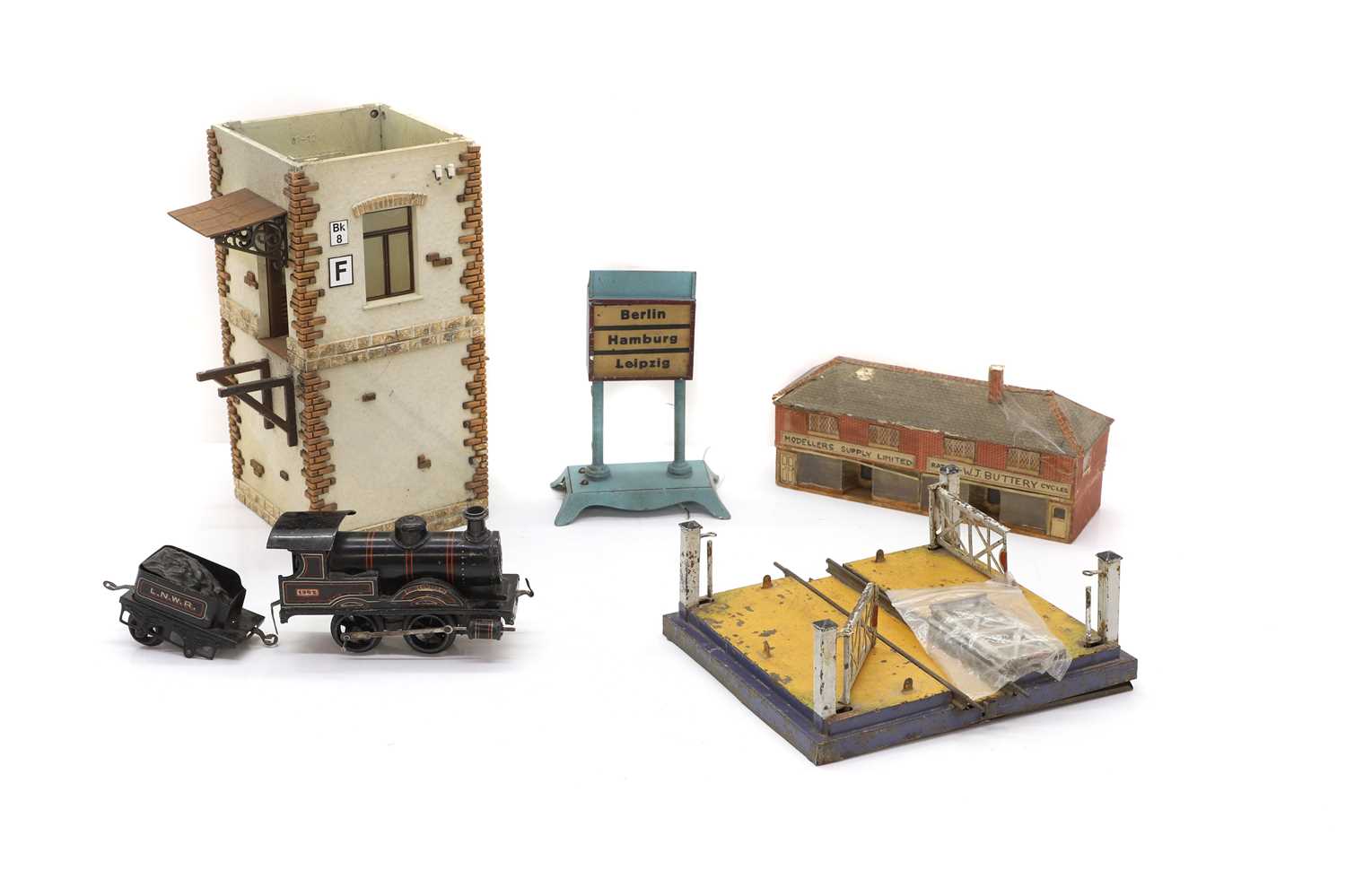 Lot 371 - A collection of vintage model railway buildings and accessories