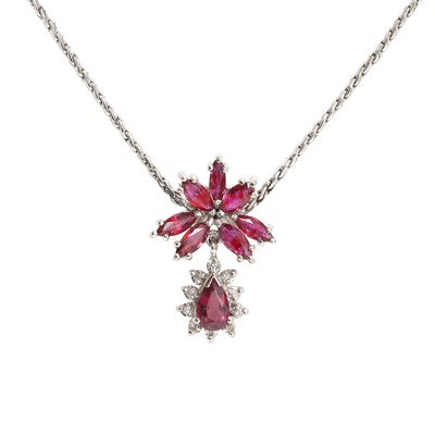 Lot 1053 - A white gold pinkish ruby and diamond drop pendant necklace