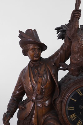 Lot 237 - A carved Black Forest clock garniture by Bergen & Co.