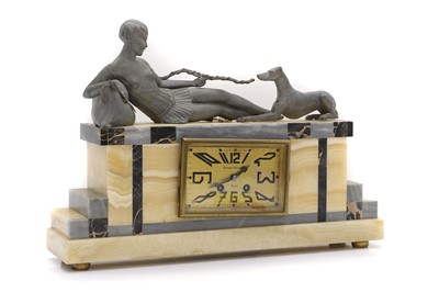 Lot 251 - An French Art Deco spelter and marble figural mantel clock