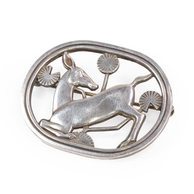 Lot 1118 - A sterling silver kneeling deer brooch, by Georg Jensen