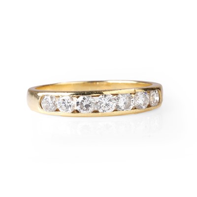 Lot 1075 - An 18ct gold diamond half eternity ring