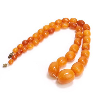 Lot 1151 - A graduated single row butterscotch amber bead necklace