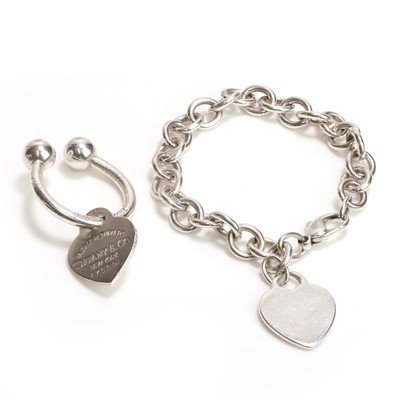 Lot 1116 - A silver 'Return to Tiffany' keyring and a silver bracelet, by Tiffany & Co.