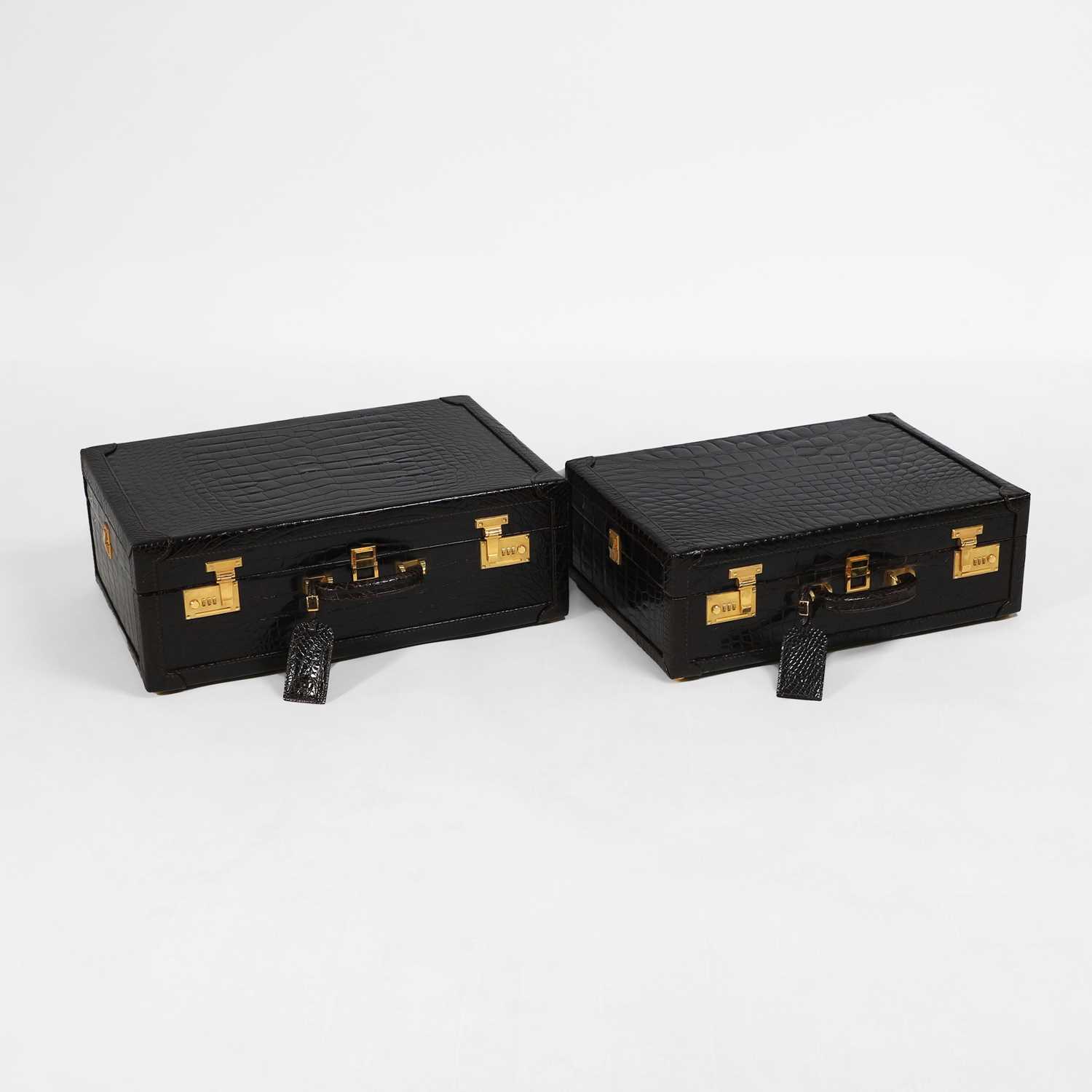 Lot 1477 - A near pair of Asprey alligator suitcases