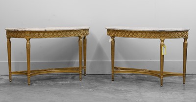 Lot 509 - A pair of Adam-style giltwood console tables