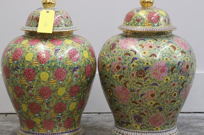 Lot 180 - A pair of Thai porcelain temple jars and covers