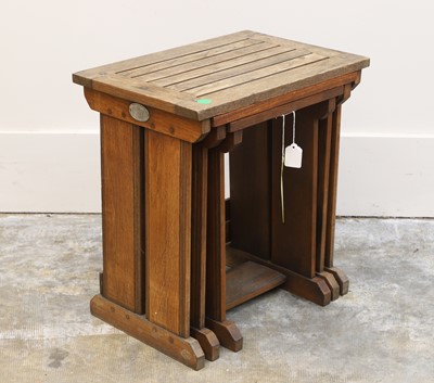 Lot 505 - A nest of three teak ships tables