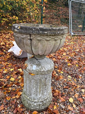 Lot 558 - A pair of reconstituted garden urns
