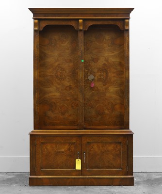 Lot 510 - A figured walnut gun cabinet