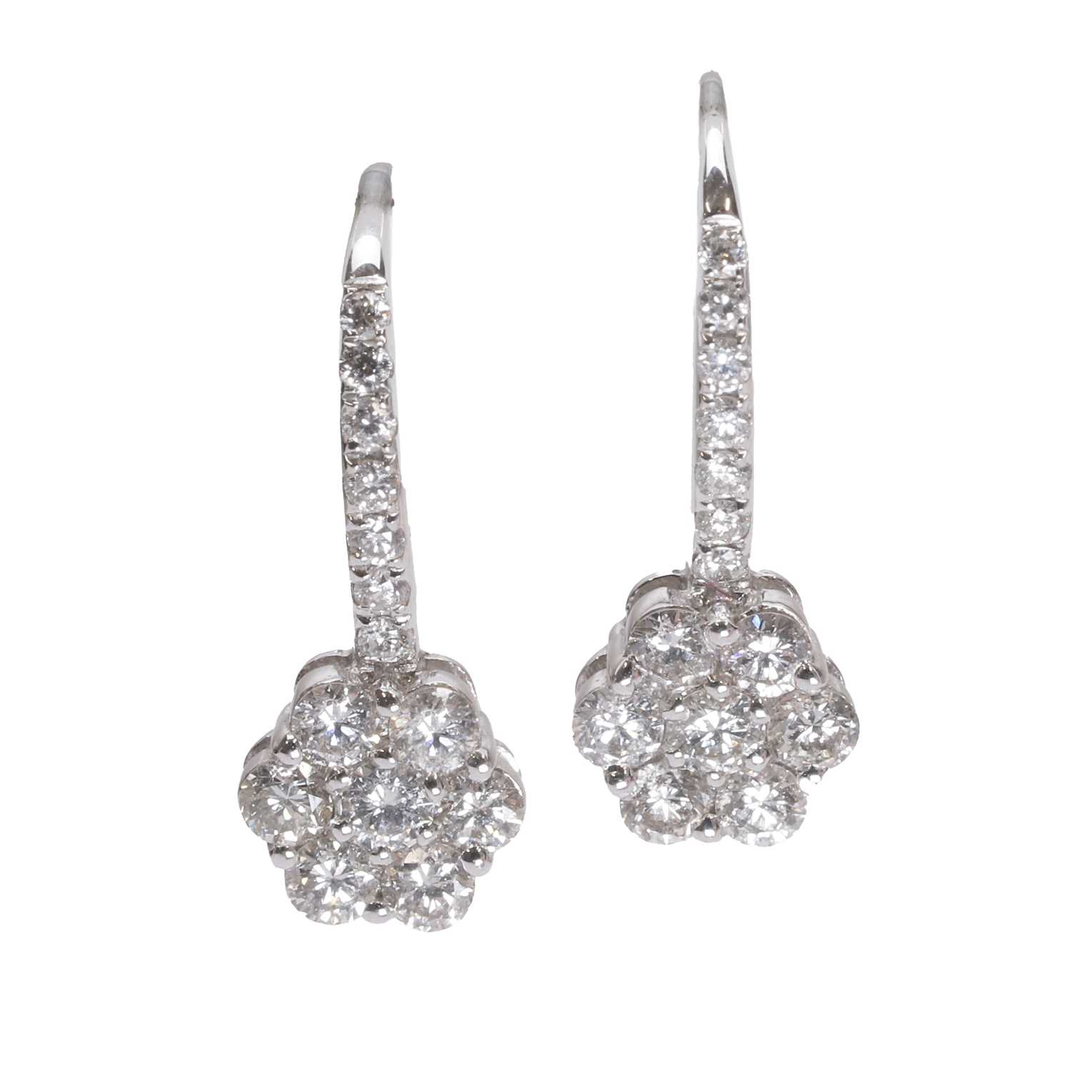 Lot 1048 - A pair of white gold diamond cluster hoop earrings