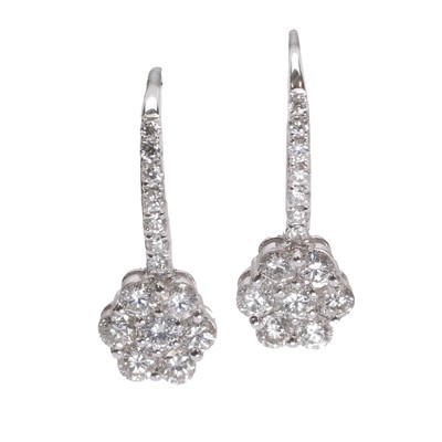 Lot 1048 - A pair of white gold diamond cluster hoop earrings