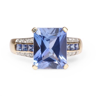 Lot 1092 - A 9ct gold synthetic sapphire and diamond ring