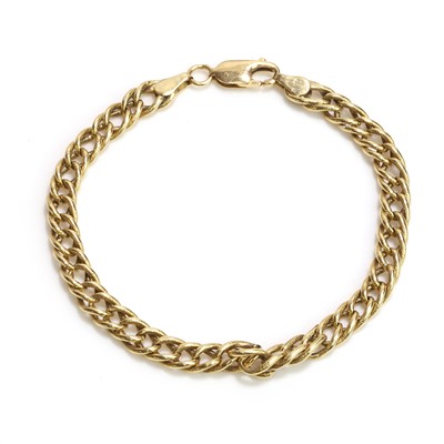 Lot 1254 - A gold curb link bracelet