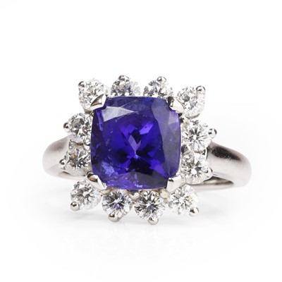 Lot 1094 - A tanzanite and diamond cluster ring
