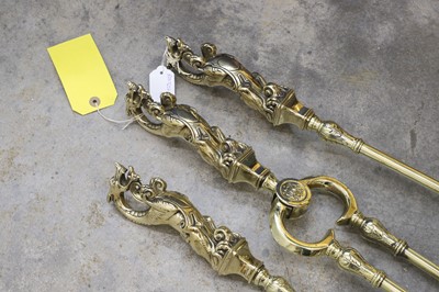 Lot 507 - A set of brass fire tools