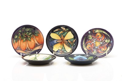 Lot 184 - A collection of five Moorcroft coasters