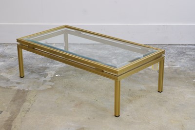 Lot 514 - A Pierre Vandel brass framed low table