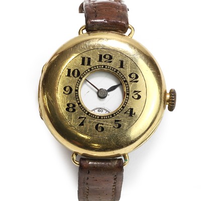 Lot 1302 - An 18ct gold half hunter mechanical strap watch