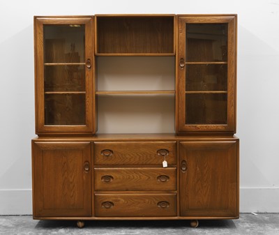 Lot 519 - An Ercol dark elm wall cabinet