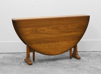 Lot 518 - An Ercol dining table