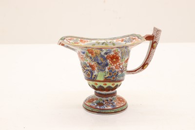 Lot 52 - A Chinese export porcelain clobbered milk jug