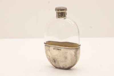 Lot 10 - A silver mounted glass hip flask