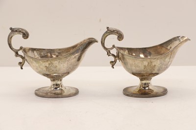 Lot 28 - A pair of George III silver sauceboats