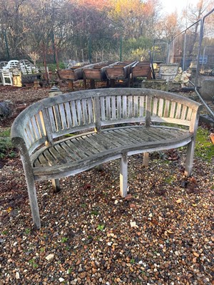 Lot 552 - A teak banana bench