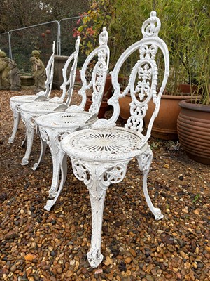 Lot 555 - Four cast garden chairs